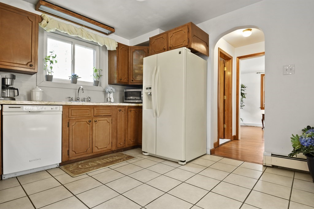 68 Winchendon Road Templeton, MA 01436 - Photo 6 of 30 a kitchen with a refrigerator a sink and cabinets