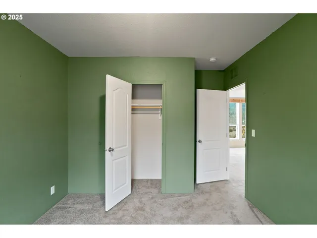 a view of a room window and wooden floor