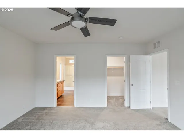 a bathroom with a mirror and a shower