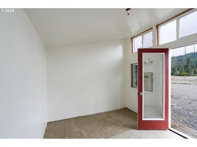 a view of entryway with wooden stairs