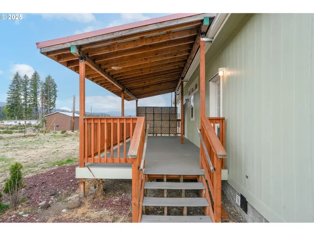 a view of a back yard from a roof deck