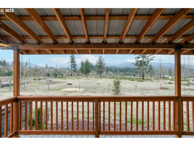a backyard of a house with outdoor seating