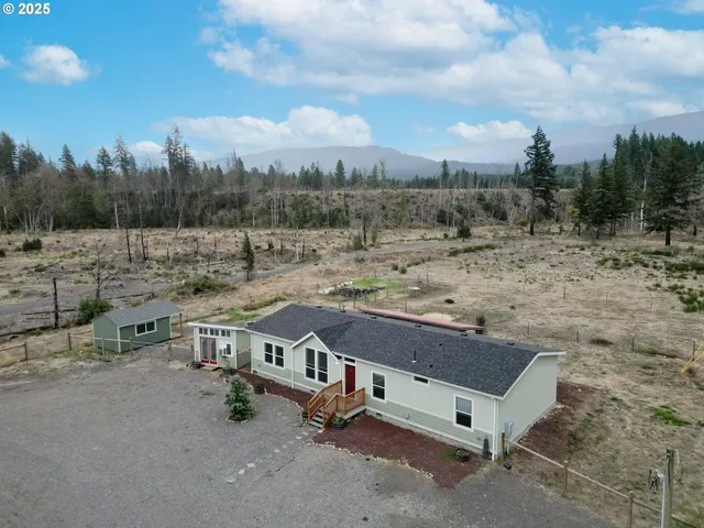 a house view with a backyard space
