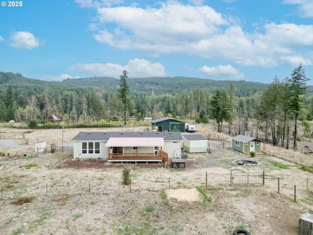 a backyard of a house with lots of green space