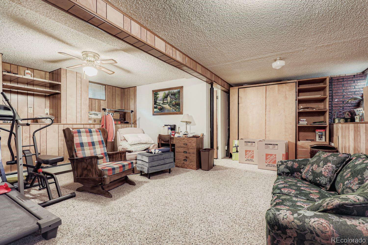 5441 East 67th Place Commerce City, CO 80022 - Photo 14 of 19 a living room with furniture and a large window