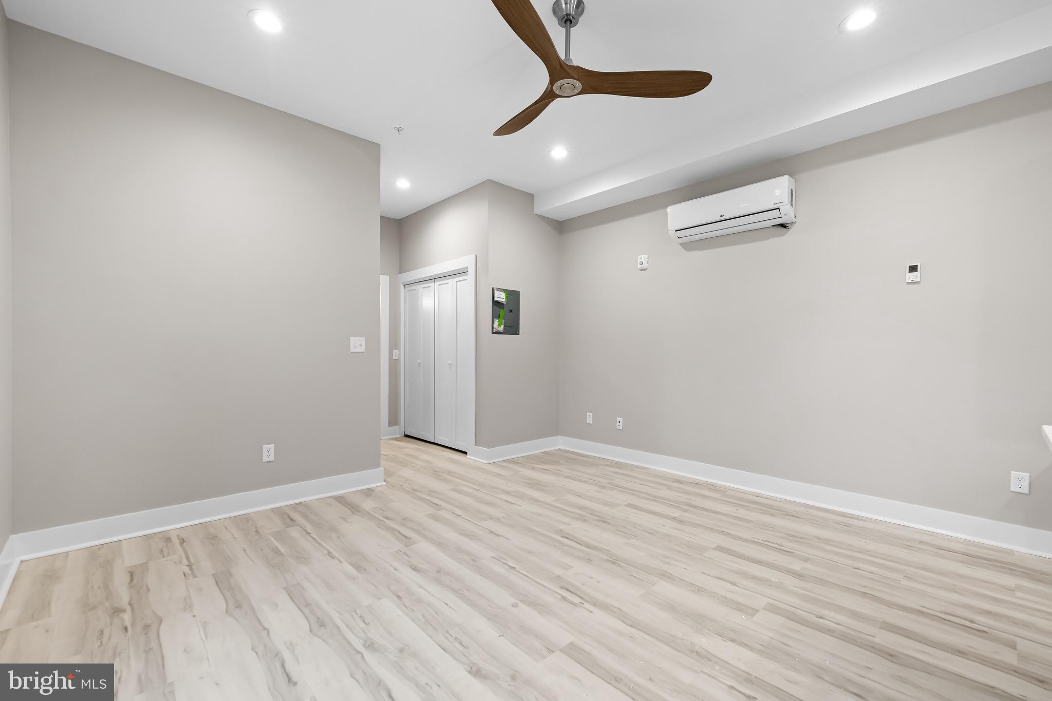 400 South Conkling Street, Unit 2 Baltimore, MD 21224 - Photo 13 of 17 a view of an empty room with wooden floor