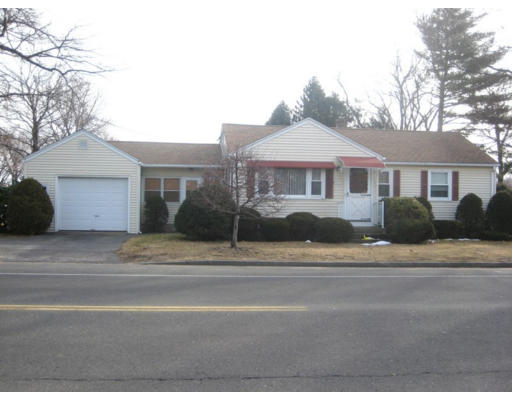 369 Granby Road Chicopee, MA 01013 - Photo 1 of 1 a front view of a house with a yard and garage