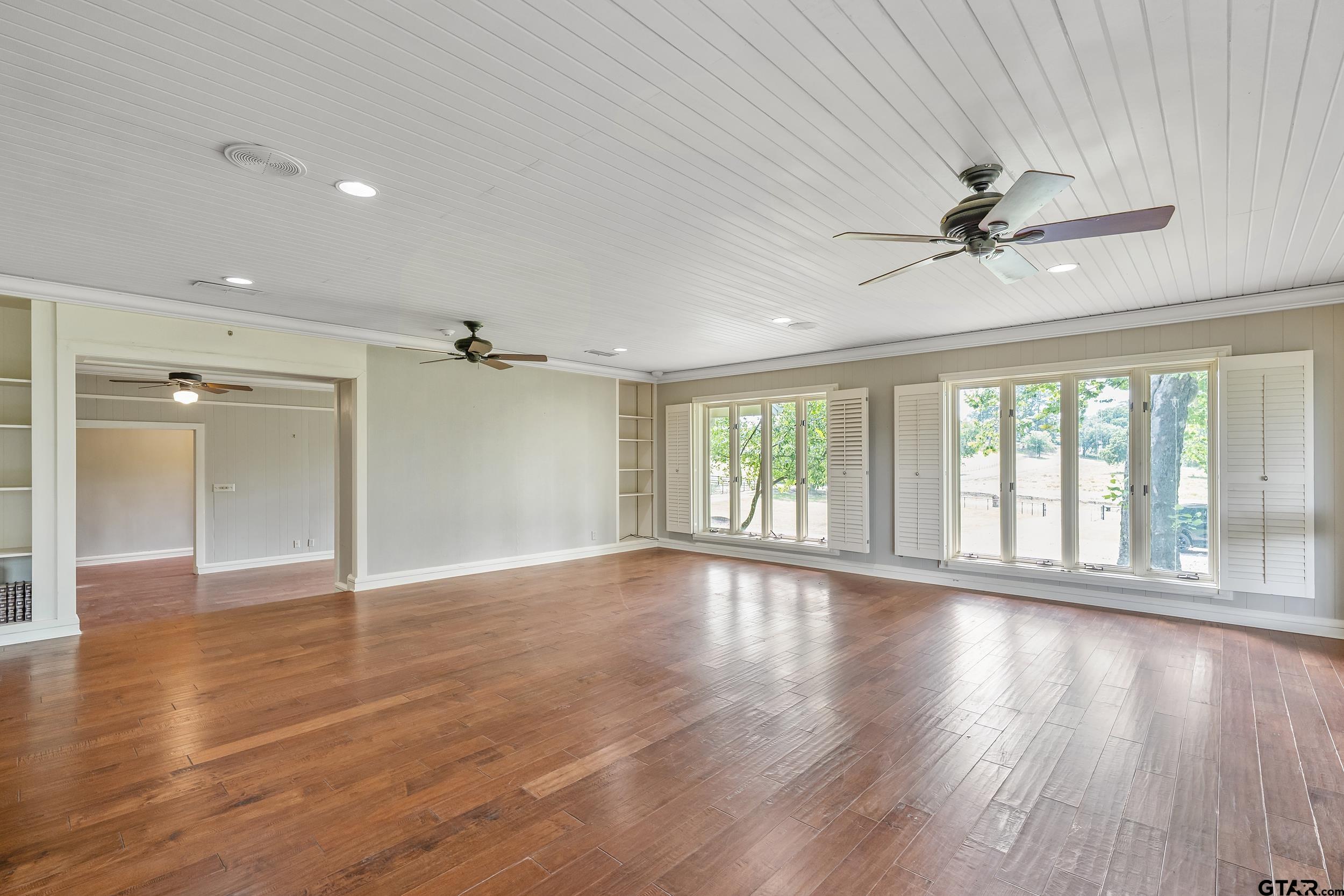 17823 County Road 132 Flint, TX 75762 - Photo 16 of 48 a view of an empty room with a window and wooden floor