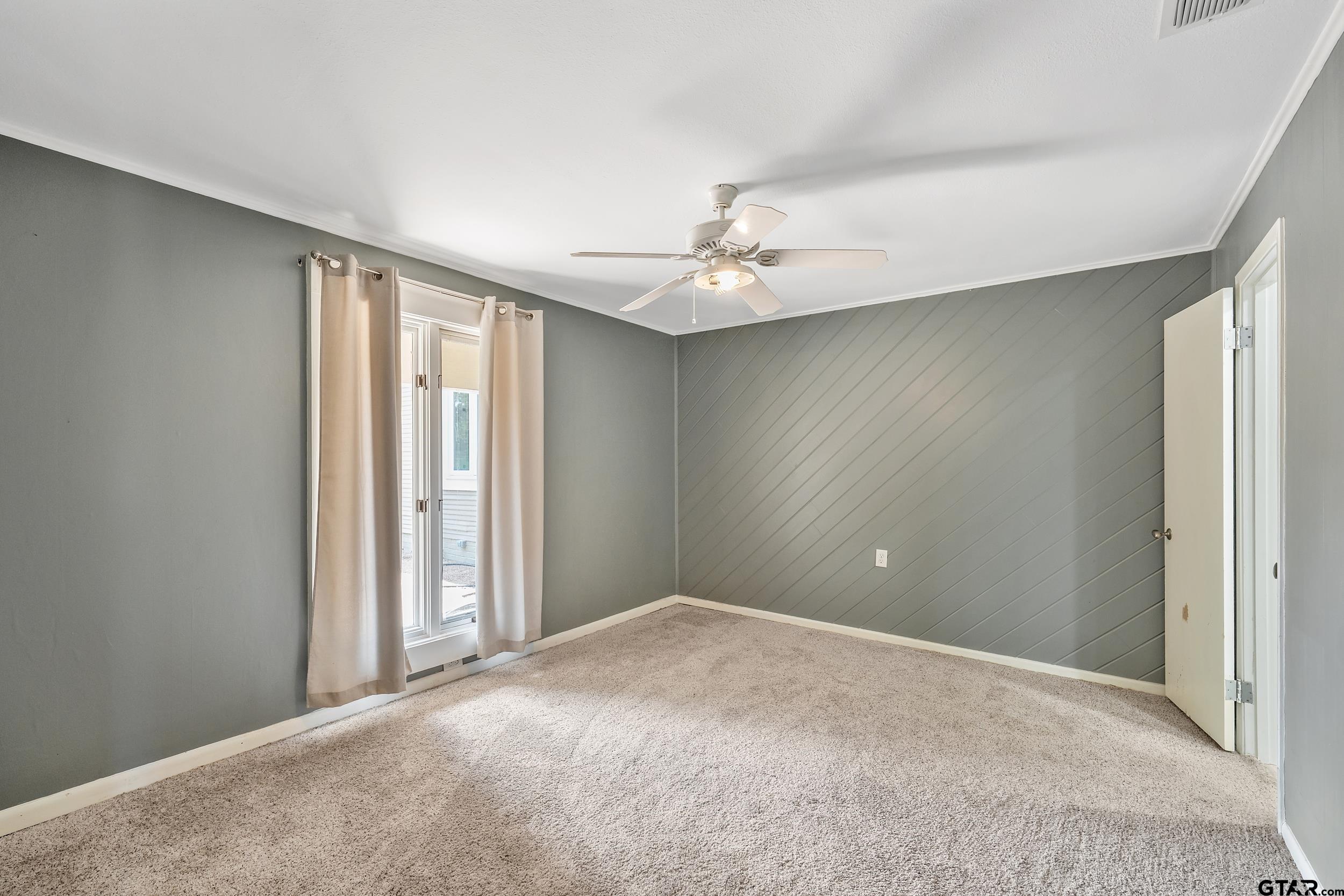 17823 County Road 132 Flint, TX 75762 - Photo 32 of 48 an empty room with windows and fan