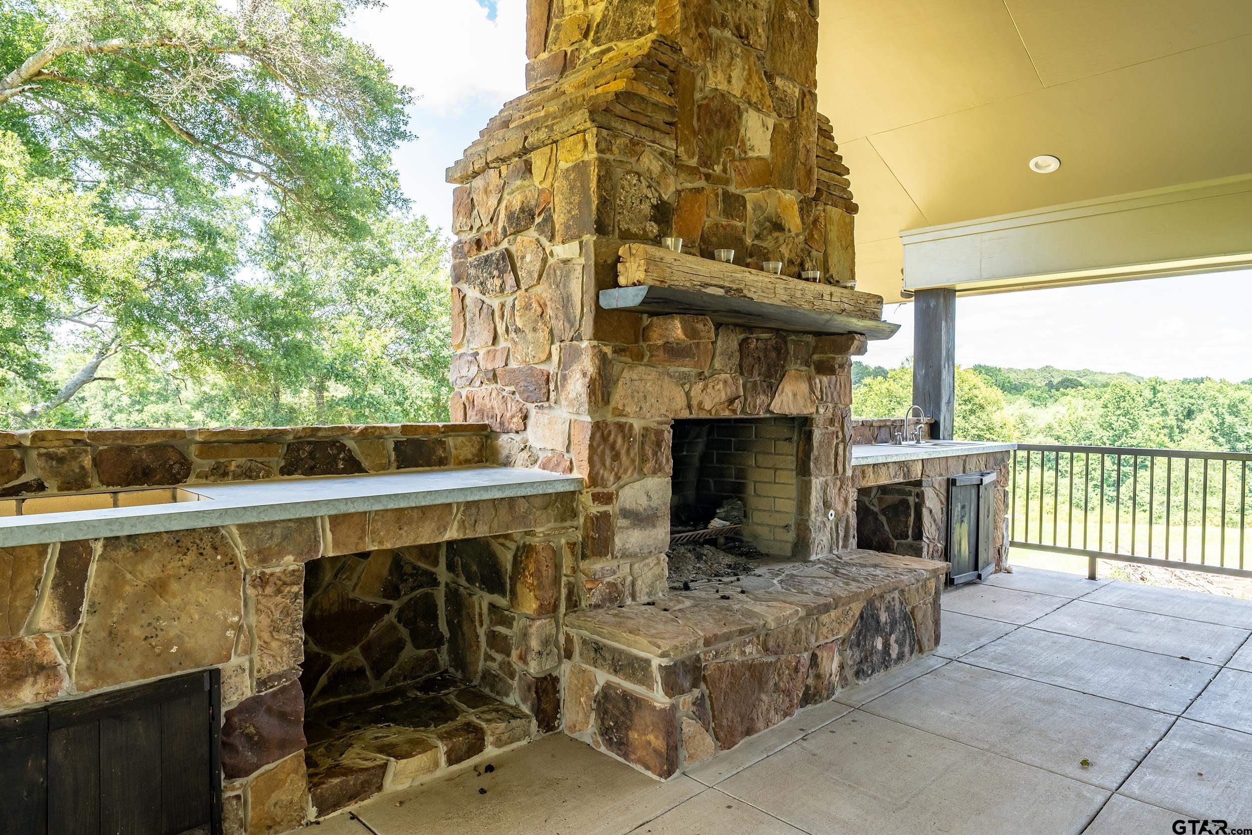 17823 County Road 132 Flint, TX 75762 - Photo 34 of 48 a balcony with furniture and a fireplace