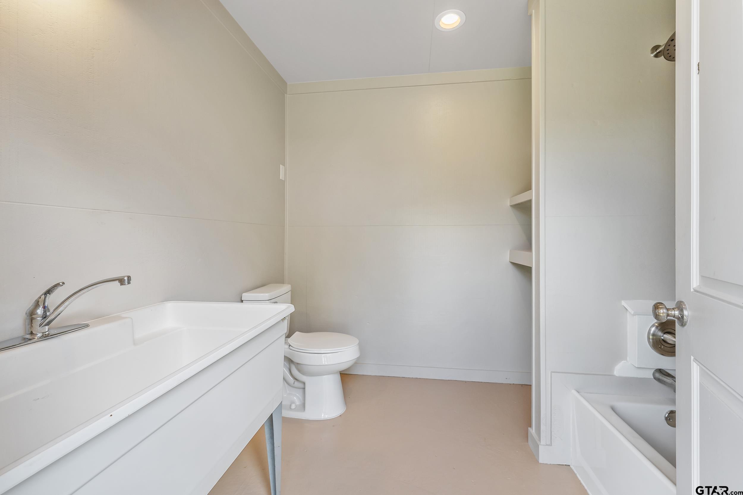 17823 County Road 132 Flint, TX 75762 - Photo 35 of 48 a bathroom with a sink and a toilet
