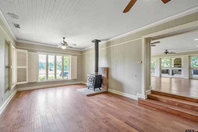 a living room with granite countertop furniture and a ceiling fan