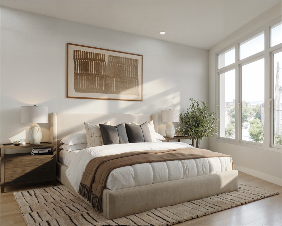 1395 Washington Street, Unit 205 Boston, MA 02118 - Photo 5 of 19 a bedroom with a bed and wooden floor