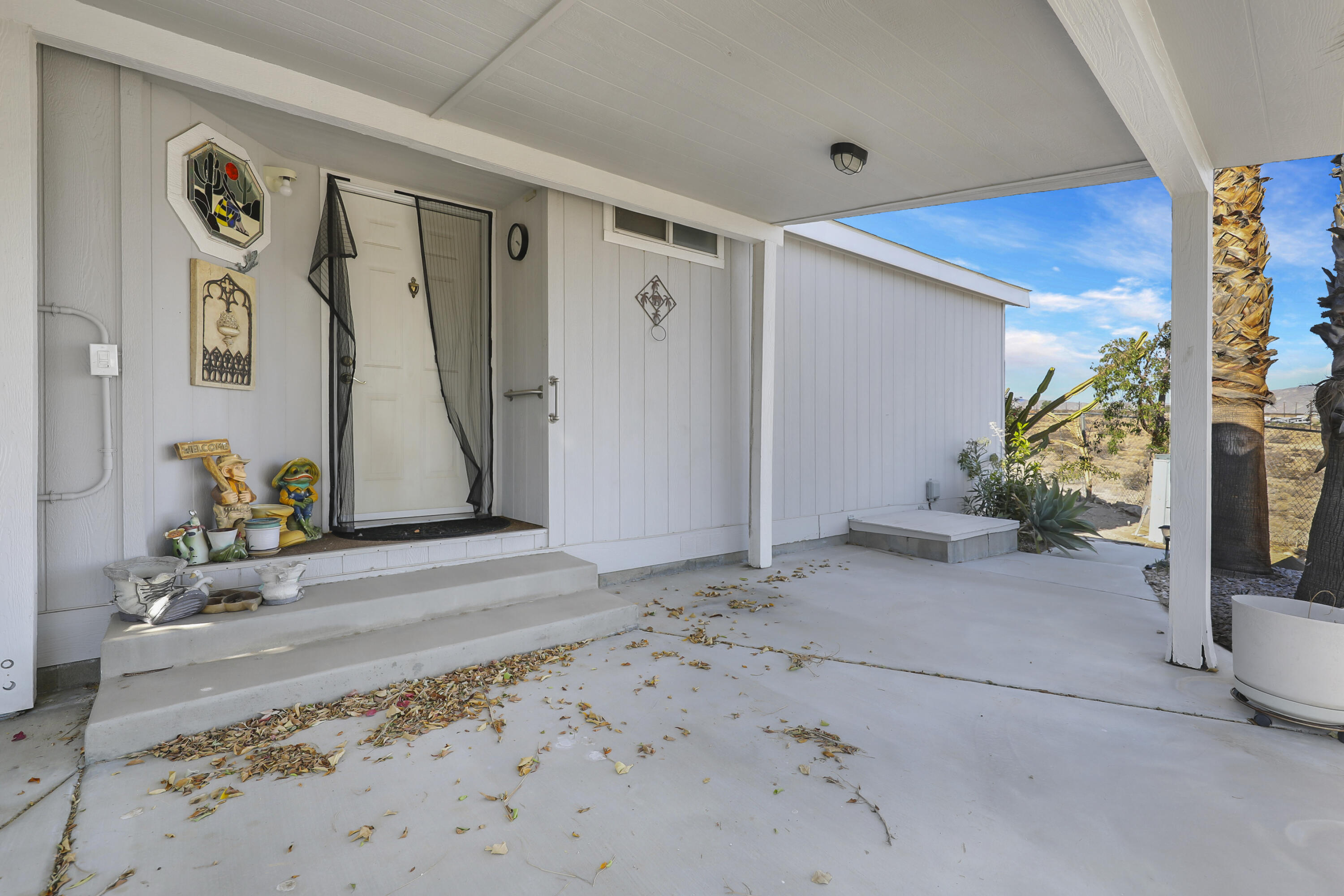 60781 Painted Hills Road Whitewater, CA 92282 - Photo 21 of 39 a view of a hallway with paintings on the wall
