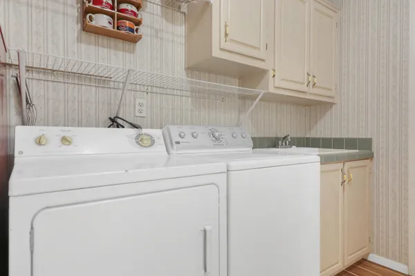 a utility room with dryer and washer