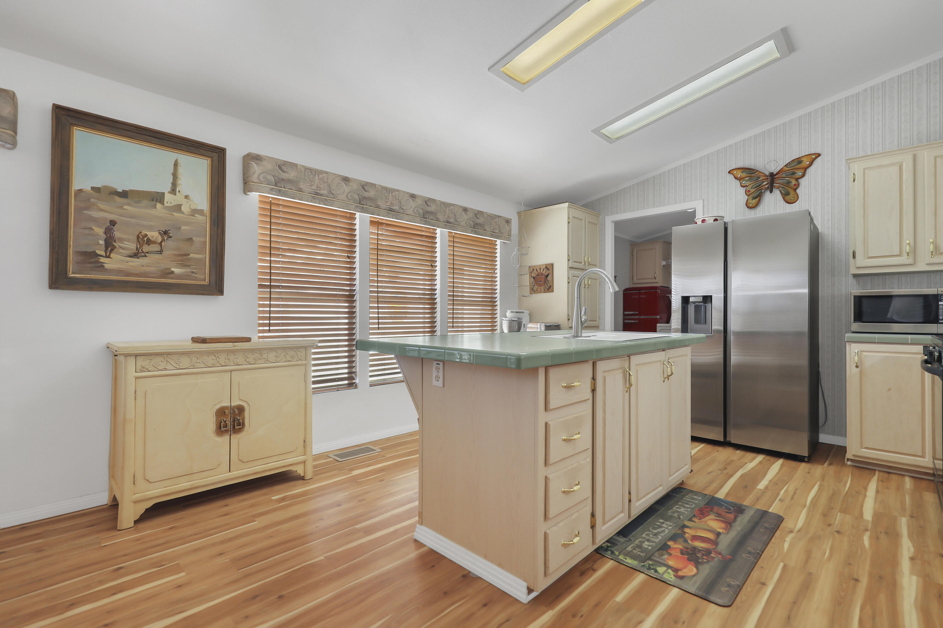 60781 Painted Hills Road Whitewater, CA 92282 - Photo 3 of 39 a kitchen with stainless steel appliances granite countertop a refrigerator a stove and a wooden floors