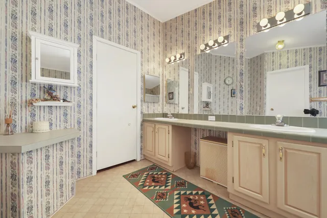 a bathroom with a sink a mirror and a shower