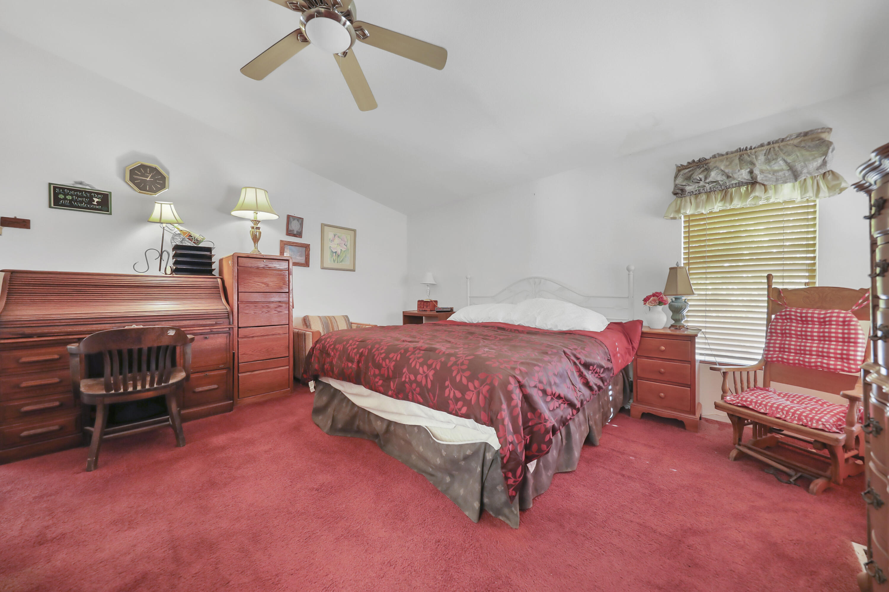 60781 Painted Hills Road Whitewater, CA 92282 - Photo 36 of 39 a spacious bedroom with a bed and a chandelier