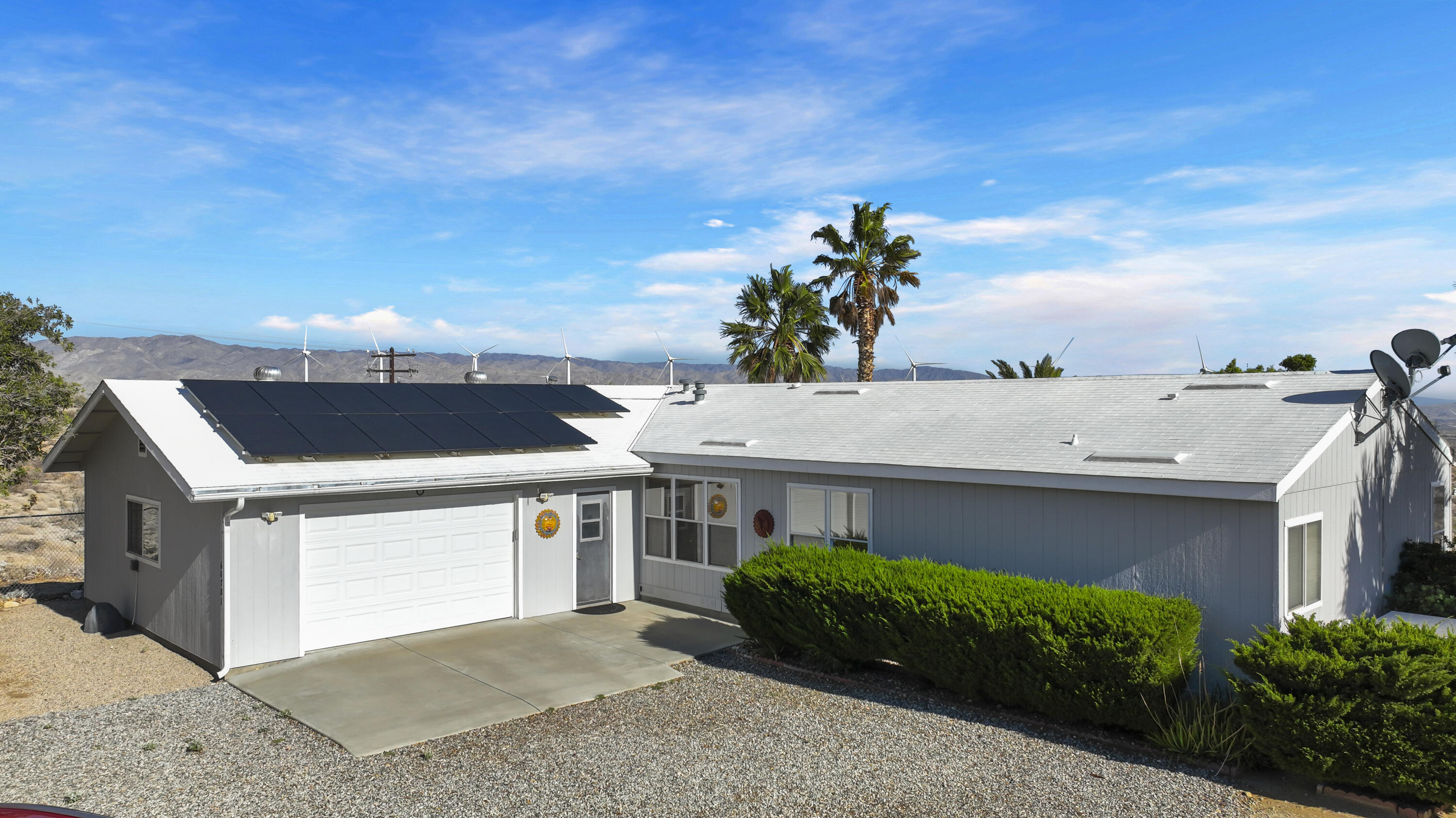 60781 Painted Hills Road Whitewater, CA 92282 - Photo 39 of 39 a front view of a house with a yard and garage