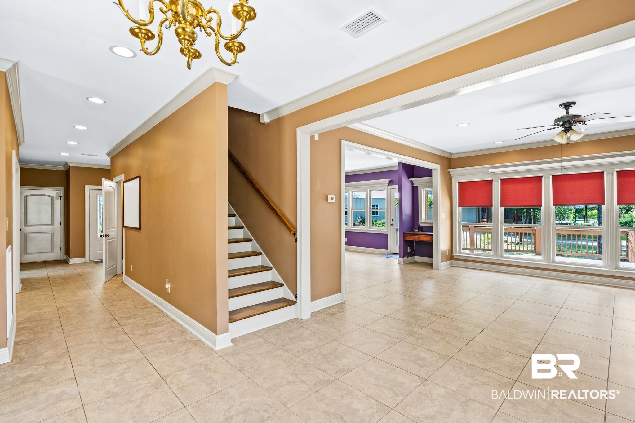 8321 Dixon Road Bay Minette, AL 36507 - Photo 35 of 79 Stairs with crown molding, ceiling fan with notable chandelier, tile patterned flooring, and a wealth of natural light