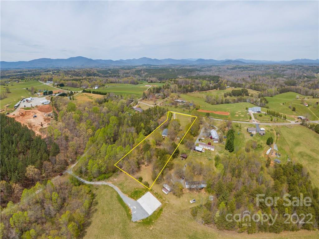 4467 Big Level Road Mill Spring, NC 28756 - Photo 23 of 33 a view of a city with mountains in the background