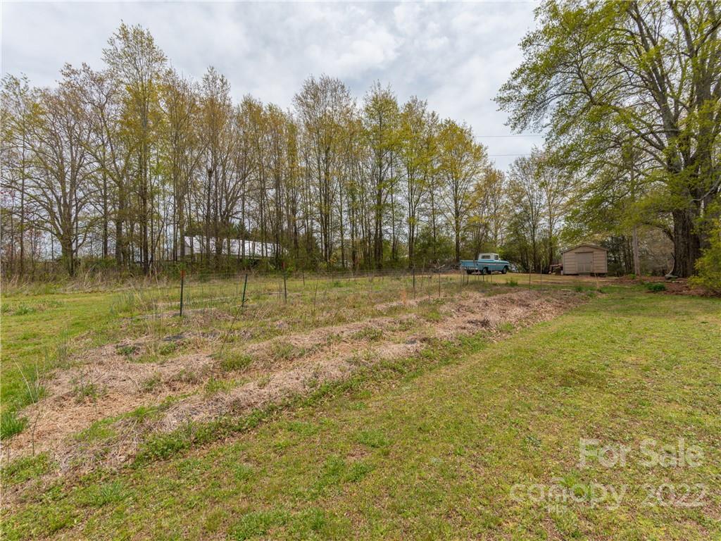 4467 Big Level Road Mill Spring, NC 28756 - Photo 24 of 33 a view of a yard with a house in the background