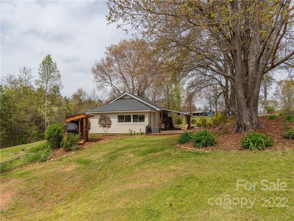 4467 Big Level Road Mill Spring, NC 28756 - Photo 26 of 33 a front view of a house with a yard