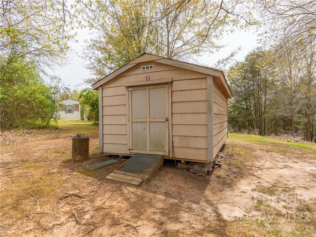 4467 Big Level Road Mill Spring, NC 28756 - Photo 27 of 33 a view of a house with a backyard