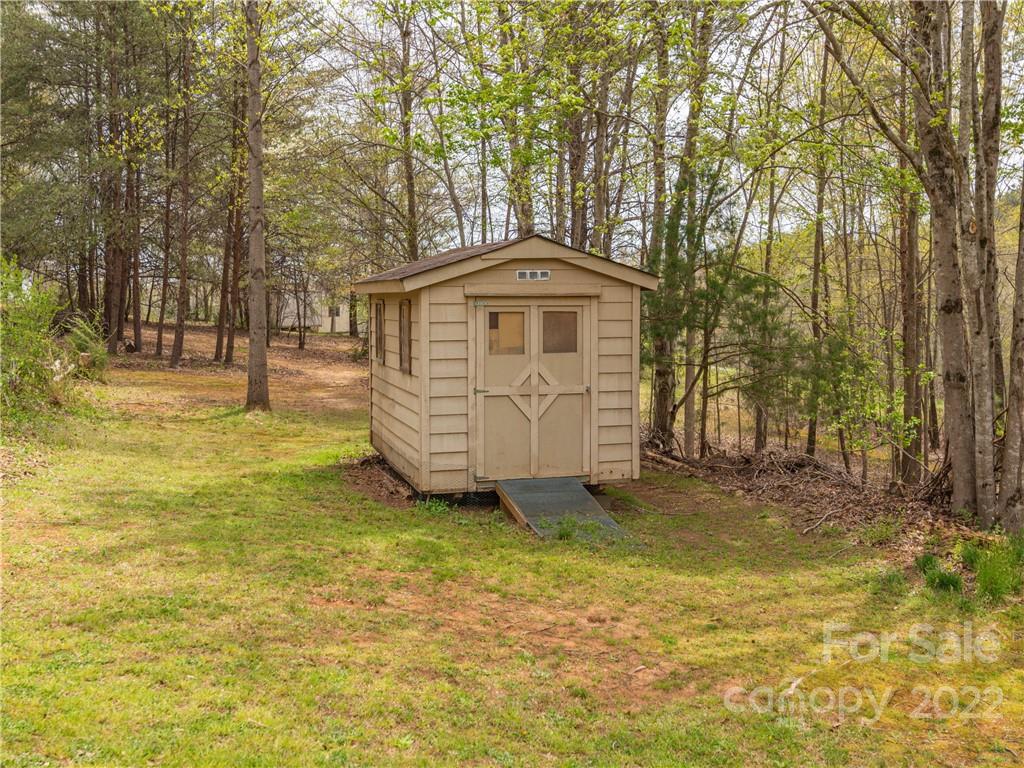 4467 Big Level Road Mill Spring, NC 28756 - Photo 28 of 33 a view of a house with a yard