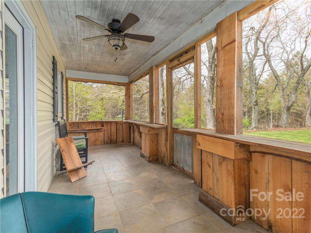 4467 Big Level Road Mill Spring, NC 28756 - Photo 3 of 33 a living room with furniture and a large window