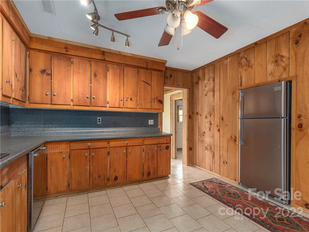 4467 Big Level Road Mill Spring, NC 28756 - Photo 7 of 33 a kitchen with stainless steel appliances granite countertop a refrigerator and microwave