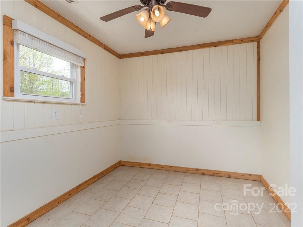 4467 Big Level Road Mill Spring, NC 28756 - Photo 10 of 33 a view of an empty room with a window
