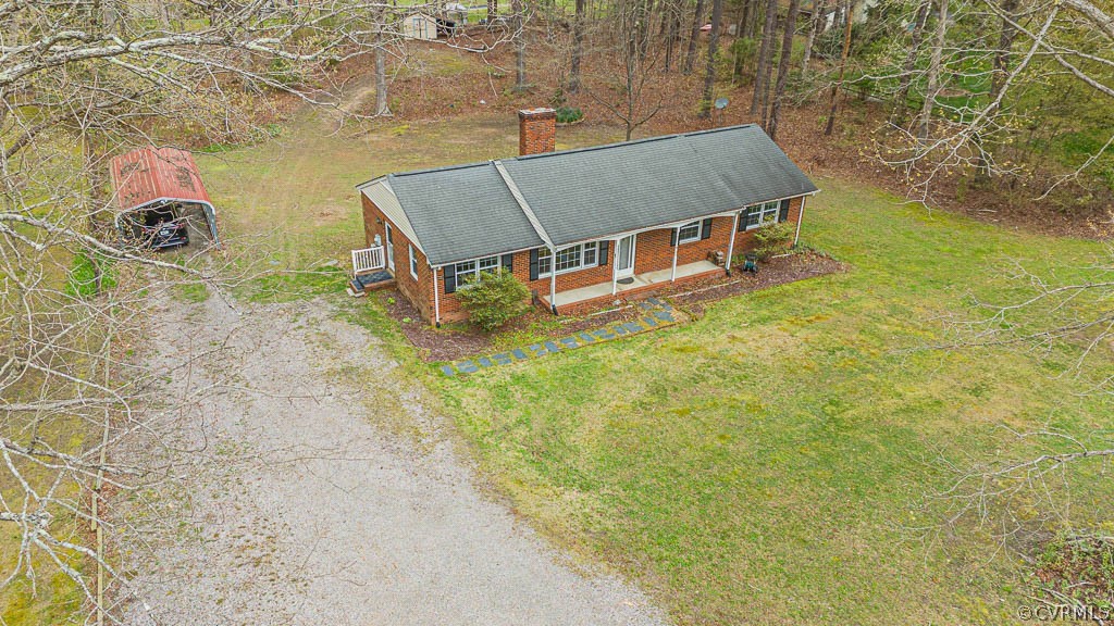 12200 Spring Run Road Chesterfield, VA 23832 - Photo 19 of 20 a backyard of a house with table and chairs