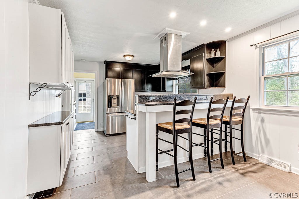 12200 Spring Run Road Chesterfield, VA 23832 - Photo 2 of 20 a kitchen with stainless steel appliances kitchen island granite countertop a refrigerator and microwave