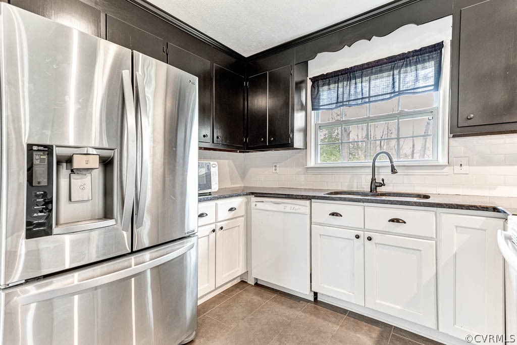 12200 Spring Run Road Chesterfield, VA 23832 - Photo 3 of 20 a kitchen with white cabinets and a refrigerator