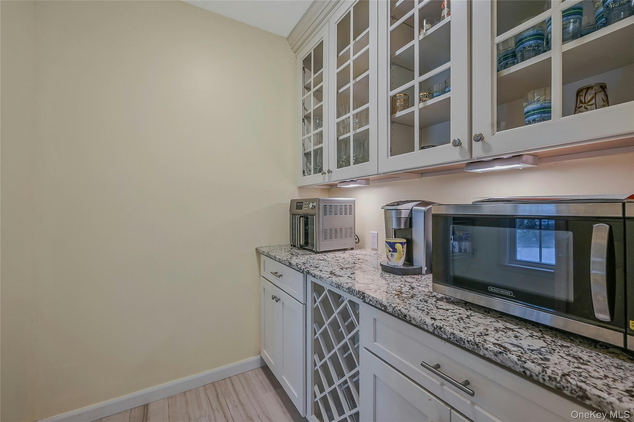 144 S Path Calverton, NY 11933 - Photo 14 of 19 a kitchen with stainless steel appliances granite countertop a sink and a microwave