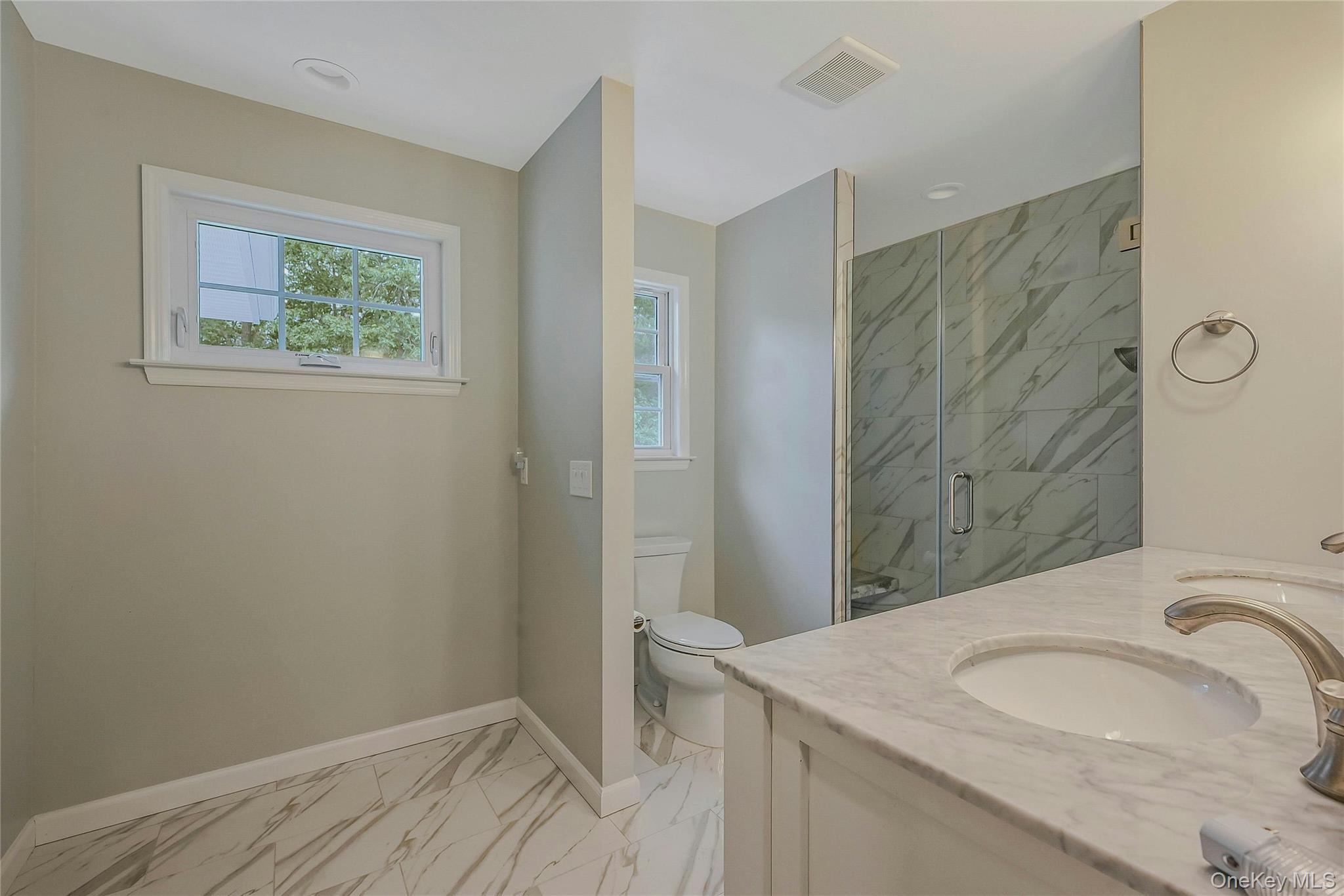 144 S Path Calverton, NY 11933 - Photo 17 of 19 a bathroom with a sink and a mirror