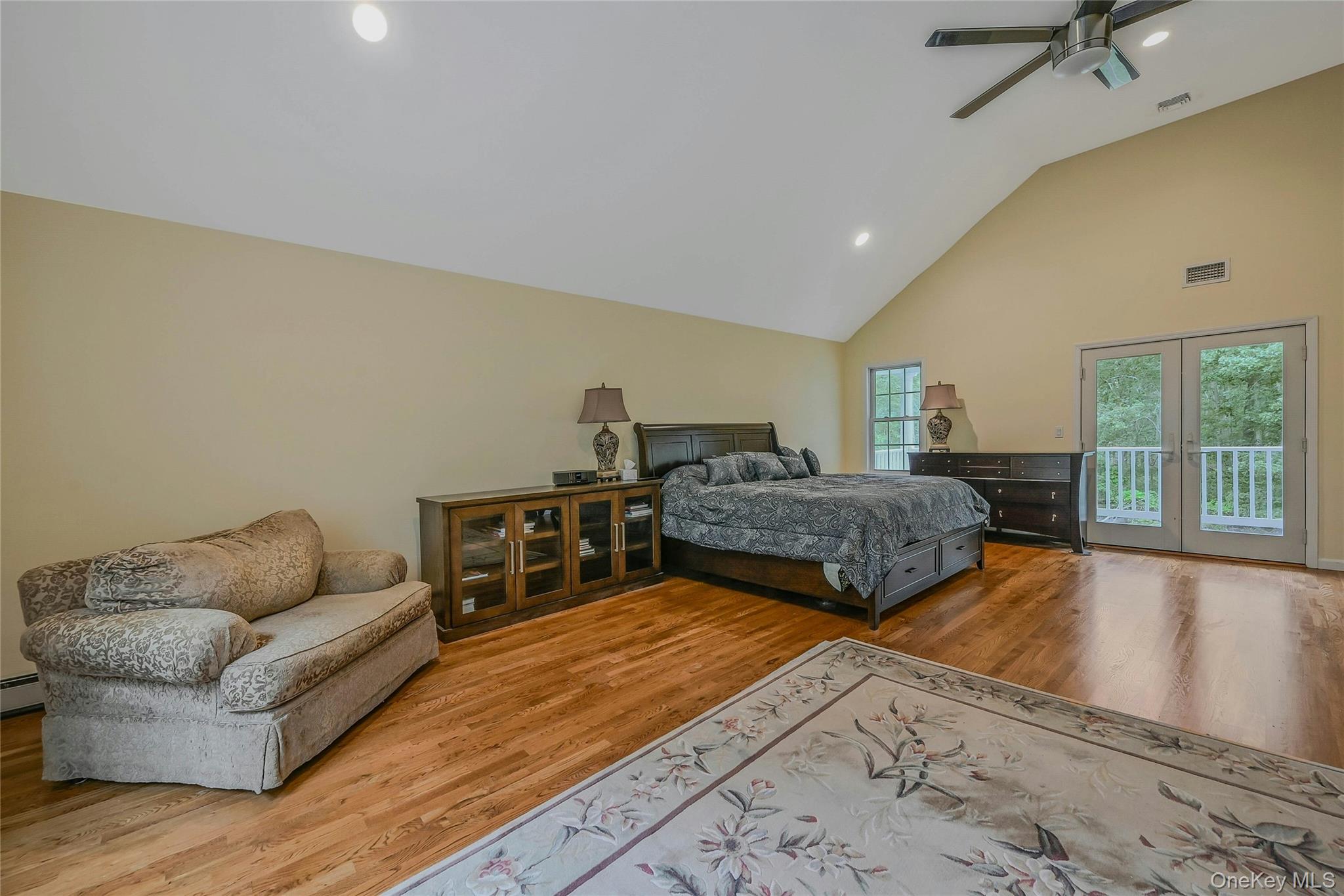 144 S Path Calverton, NY 11933 - Photo 18 of 19 a living room with furniture large window and wooden floor