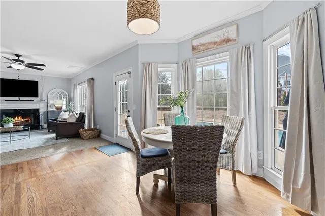 a bathroom with a granite countertop sink a toilet and a mirror