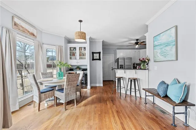 a bathroom with a sink vanity mirror and toilet