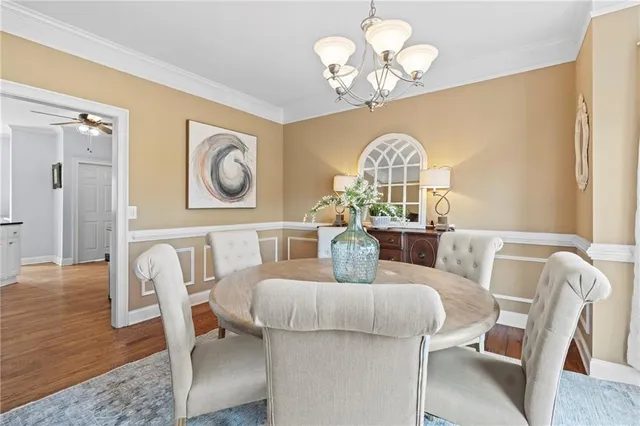 a bathroom with a sink toilet and a mirror