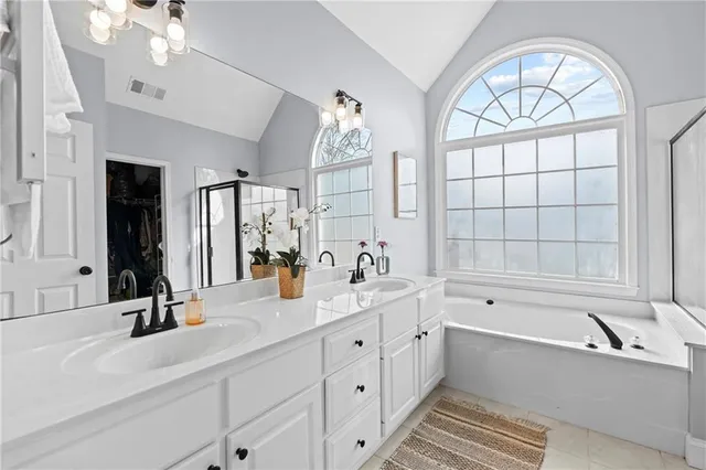 a sign board with a small yard and large trees