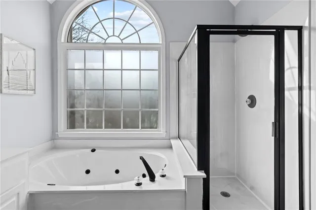 a view of a patio with a table and chairs under an umbrella