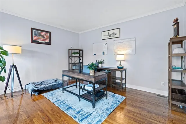 a kitchen with granite countertop white cabinets and sink