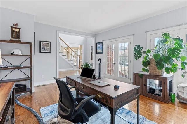 a kitchen with stainless steel appliances kitchen island granite countertop a stove and a sink
