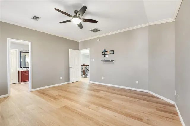 a en suite bathroom with a granite countertop sink and a mirror