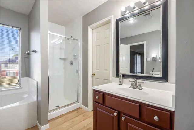 a white bath tub sitting next to a small bathroom