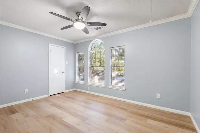 a bathroom with a toilet a sink a mirror and vanity
