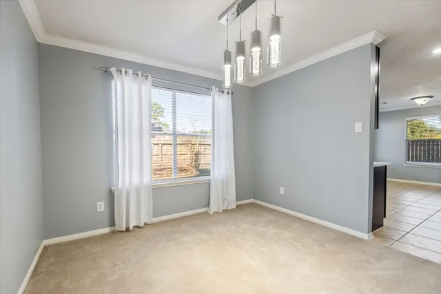 a kitchen with sink stove and cabinets