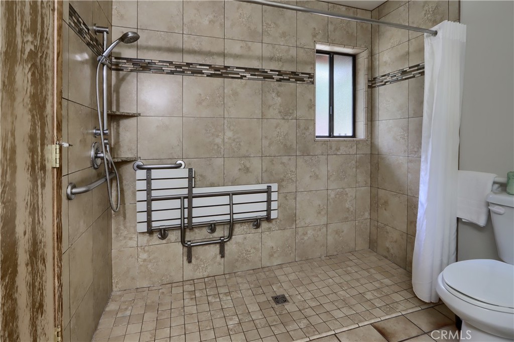 8041 Chilnualna Falls Road Wawona, CA 95389 - Photo 25 of 46 a bathroom with a toilet and a shower